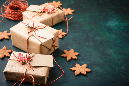 Gingerbread christmas cookies snowflakes with decoration and christmas gift boxes. Space for text.