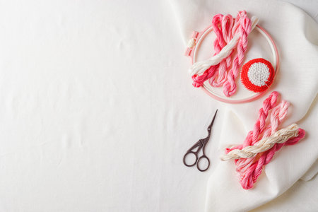 Set for embroidery. Linen fabric, patterns for embroidery, hoops, threads of pink colors and...
