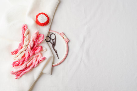 Set for embroidery. Linen fabric, patterns for embroidery, hoops, threads of pink colors and...