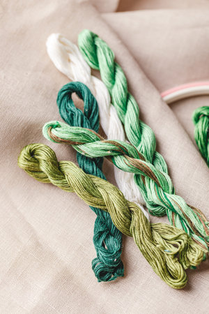 Set for embroidery. Linen fabric, patterns for embroidery, hoop, green thread and needles. Copy...