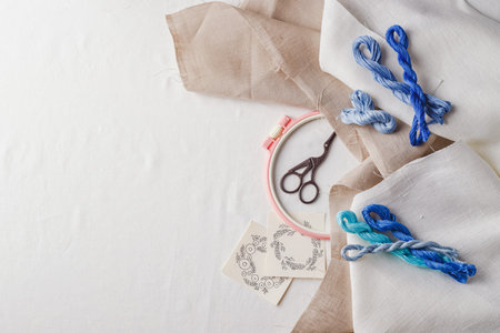 Set for embroidery. Linen fabric, patterns for embroidery, hoops, threads of blue colors and...