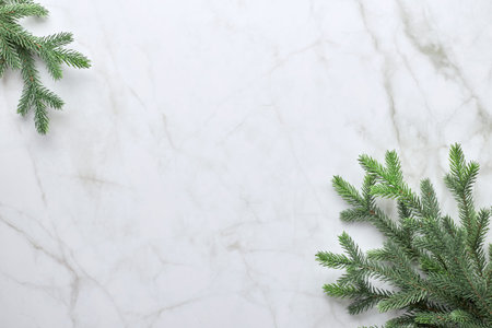 Christmas background with branches of a Christmas tree in the form of a frame. Flat lay, top view...
