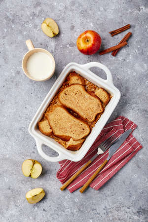 Bread pudding breakfast casserole made from wheat bread, eggs, milk and grated applesの写真素材