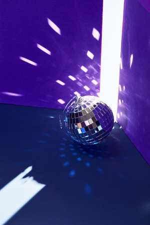 Disco mirror balls light reflections on ceiling and floorの写真素材