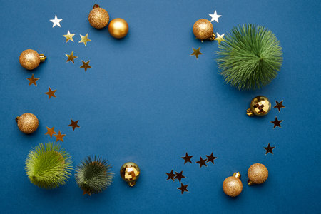 Christmas flat lay scene with golden decorationsの写真素材