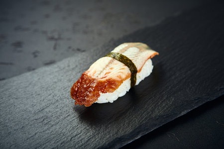 Nigiri Sushi with eel on dark background. Sushi menu. Japanese food.の写真素材