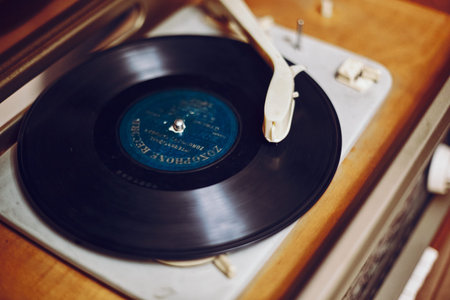 Istra, Russia - September 06, 2021: Vinyl record, spinning on a turntable, Vintage record player...