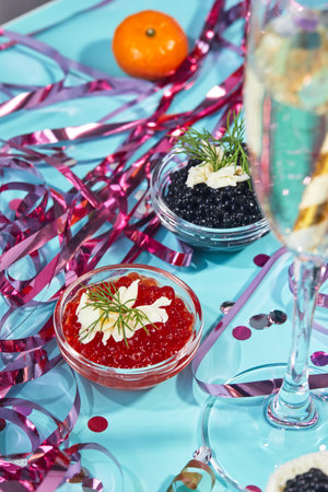 Two bowls with red and black caviar on the New Year's table. Party in Russian styleの写真素材