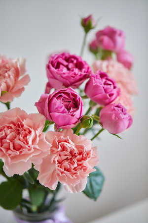 Bouquet of lilac roses and pink carnations. Close upの写真素材