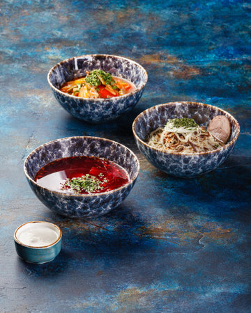 Different soups and sauses from different countries cousine with vegetables or meatの写真素材