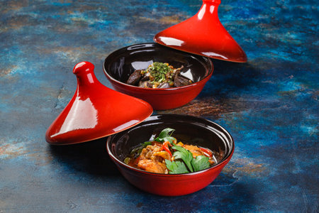 Chicken and liver dishes cooked in tagine. Traditional way of cooking food in Arab countriesの写真素材