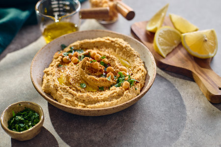Delicious hummus with olive oil, chickpeas and parsleyの写真素材