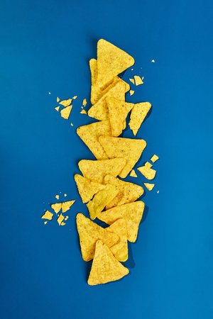 Nachos corn chips on blue background.の写真素材