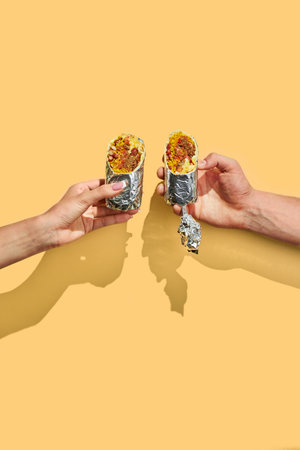 Traditional Mexican Beef Burrito with Nachos Chips and Salsa Sauce.の写真素材