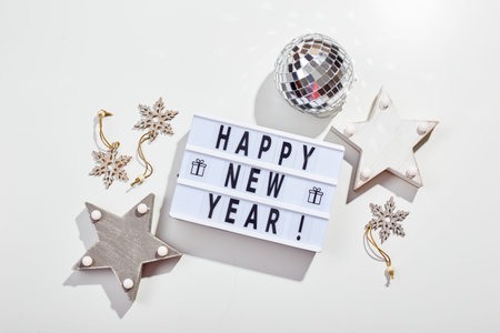 New Year or Christmas composition, flat lay, top view. Light box inscription Happy New Year,...