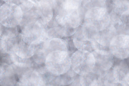 Defocused Gentle delicate lilac pastel glitter lights background. Blurred Bokeh Christmas light...
