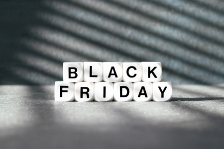 Sale banner with text word Black Friday on dark background with sunlight streaks. Black Friday sale conceptの写真素材