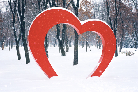 Big Red Heart street installation in winter park. Valentine's Day, love, romance background.の写真素材