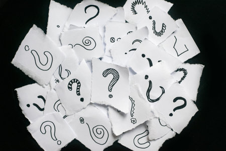 Many question marks on white papers. Doodle drawn question marks on scraps of paper. Choice,...