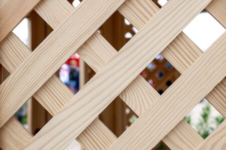 Old wooden lattice background. Partition wooden texture. Wooden arbor pavilion with lattice.の写真素材