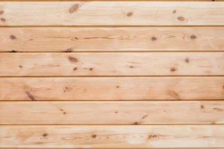 Wood Glued timber plank background. Wooden construction glued laminated timber in the wall of the house. Glued beams texture. Natural pattern pine wood background.の写真素材
