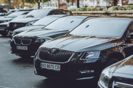 Car parking. Black premium cars parked in city centre. Car Parking Problem in Urban Areas. Kiev, Ukraine - September 02, 2019.のeditorial素材