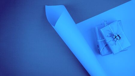 Blue Color toned festive background with gift boxes. Blue toned trend web banner background.の写真素材