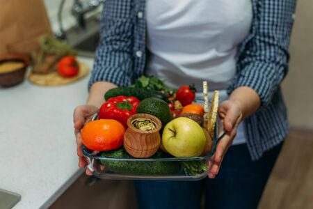 Whole Foods, Plant based diet ingredients in eco friendly zero waste packaging. Fresh raw food seasonal vegetables on home kitchen. Vegetarian, vegan food cooking ingredients.の写真素材