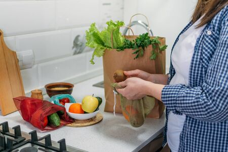 Whole Foods, Plant based diet ingredients in eco friendly zero waste packaging. Fresh raw food seasonal vegetables on home kitchen. Vegetarian, vegan food cooking ingredients.の写真素材
