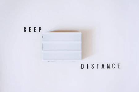 Keep Distance, social distancing, quarantine or isolation measures concept with lightbox and text...