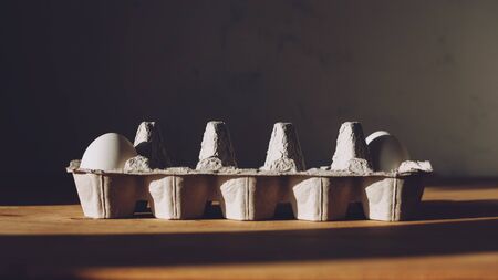 Social distancing, stay safe, post covid, new normal concept with only two egg in packaging paper mould box.の写真素材