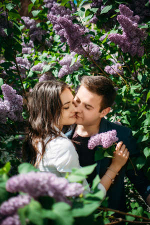 Happy kissing day. The couple kissing on the city street. Love, happiness, young family, dating conceptの写真素材