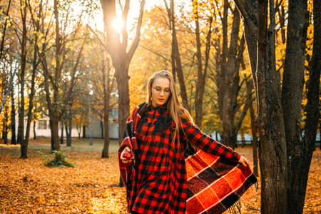 Life Style Portrait of Happy Woman in fall park. Beautiful girl on the nature picnic camping....