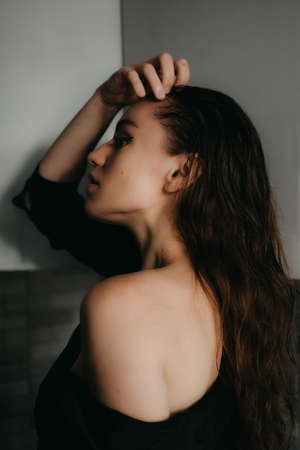 Closeup female portrait. Fashion evening elegance eyeliner makeup on model eyes. Make-up with black eyeliner.の写真素材