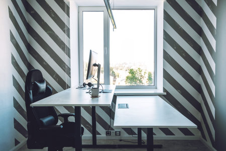 Empty office space while officer is working from home to avoid corona virus. Open space office in...