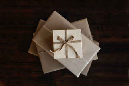 Top view stack of many xmas gift boxes wrapped in recycled kraft paper. Eco-Friendly, Sustainable,...