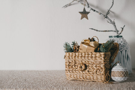 Natural Christmas decorations ideas. budget homemade DIY natural zero waste decor for home. Earth-Friendly Natural Christmas decor with tree branch, macrame and wooden toys on tableの写真素材