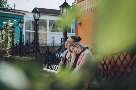 LGBT Lesbian couple love moments concept. Two Young lesbians girls hugging and walking outdoors....
