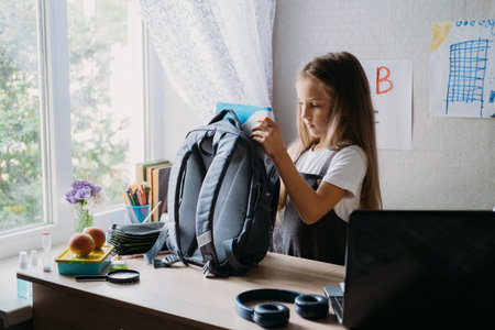 Back to school, schoolchildren hygiene, safety precautions after coronavirus. The schoolgirl is...
