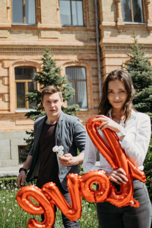 Valentines day celebration, love and dating outdoor concept. Happy loving couple walking on the city...