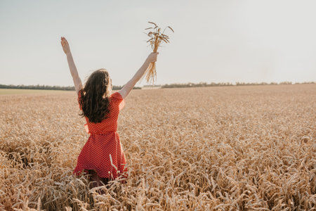 Focus on Yourself, Motivation and inspiration, rethink everything, freedom, . Happy young girl enjoying life in the wheat field on sun summer dayの写真素材