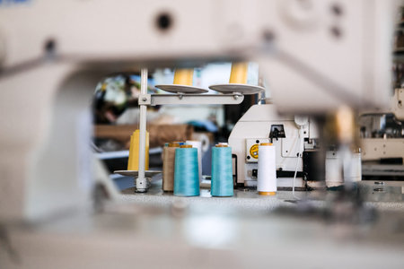 Thread sewing overlock. Modern overlock sewing machine. Thread Serger. Sewing factory. Clothing...