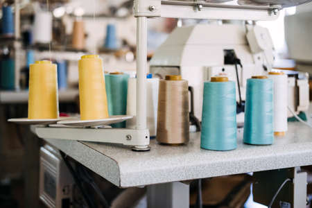 Thread sewing overlock. Modern overlock sewing machine. Thread Serger. Sewing factory. Clothing industry, thread, sewing suppliesの写真素材