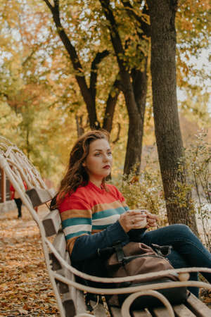 Body Shaming, Low self-worth. Body positive, diversity, Body neutrality, body positivity, resolutions self-improvement. Sad plus size woman walking in autumn parkの写真素材