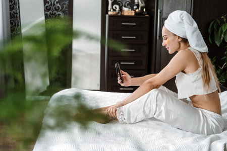 Self care, beauty, skin routine, Everyday Skin Care and Wellness. Young Woman in pajamas, towel on...
