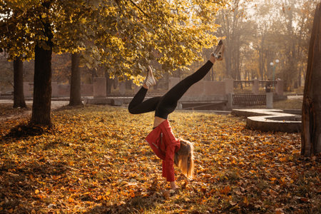 Hello fall, autumn season, fall mood, positive emotions. Teenager girl jumping with transparent...