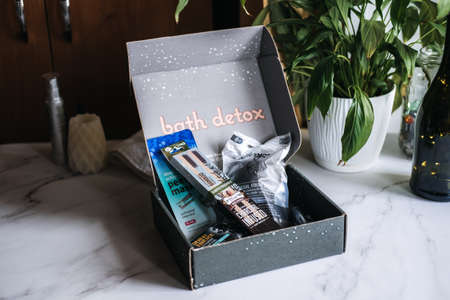 Bath detox beauty box with black charcoal cosmetic and beauty devices. Beauty box with Konjac Sponge, Cleansing Oil, Beauty Mask, Soap Bar, Bamboo Toothbrush. Kropivnitskiy, Ukraine, March 20, 2021のeditorial素材