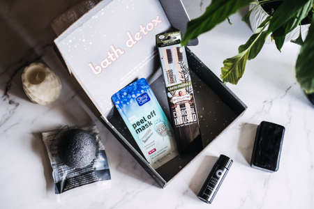 Bath detox beauty box with black charcoal cosmetic and beauty devices. Beauty box with Konjac Sponge, Cleansing Oil, Beauty Mask, Soap Bar, Bamboo Toothbrush. Kropivnitskiy, Ukraine, March 20, 2021のeditorial素材