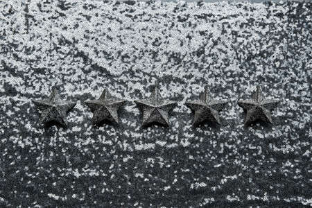 The best rating, Feedback, Customer Experience Concept. Five silver star on glitter silver background. Five star excellent rating on grey backgroundの写真素材