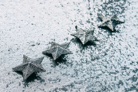 The best rating, Feedback, Customer Experience Concept. Five silver star on glitter silver background. Five star excellent rating on grey backgroundの写真素材